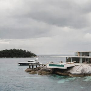 A sleek modern glass and wood villa built on a rocky island shore, with a cantilevered pool and a luxury yacht docked nearby on a calm, overcast day.